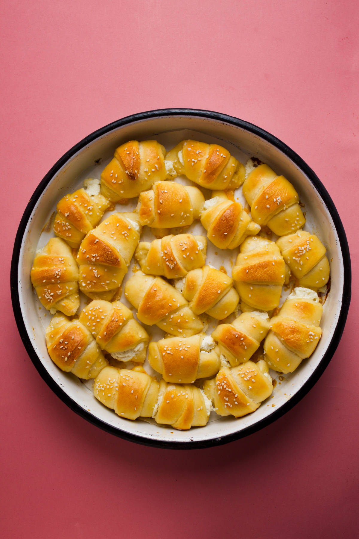 Overhead photo of crescent rolls in a round pan.