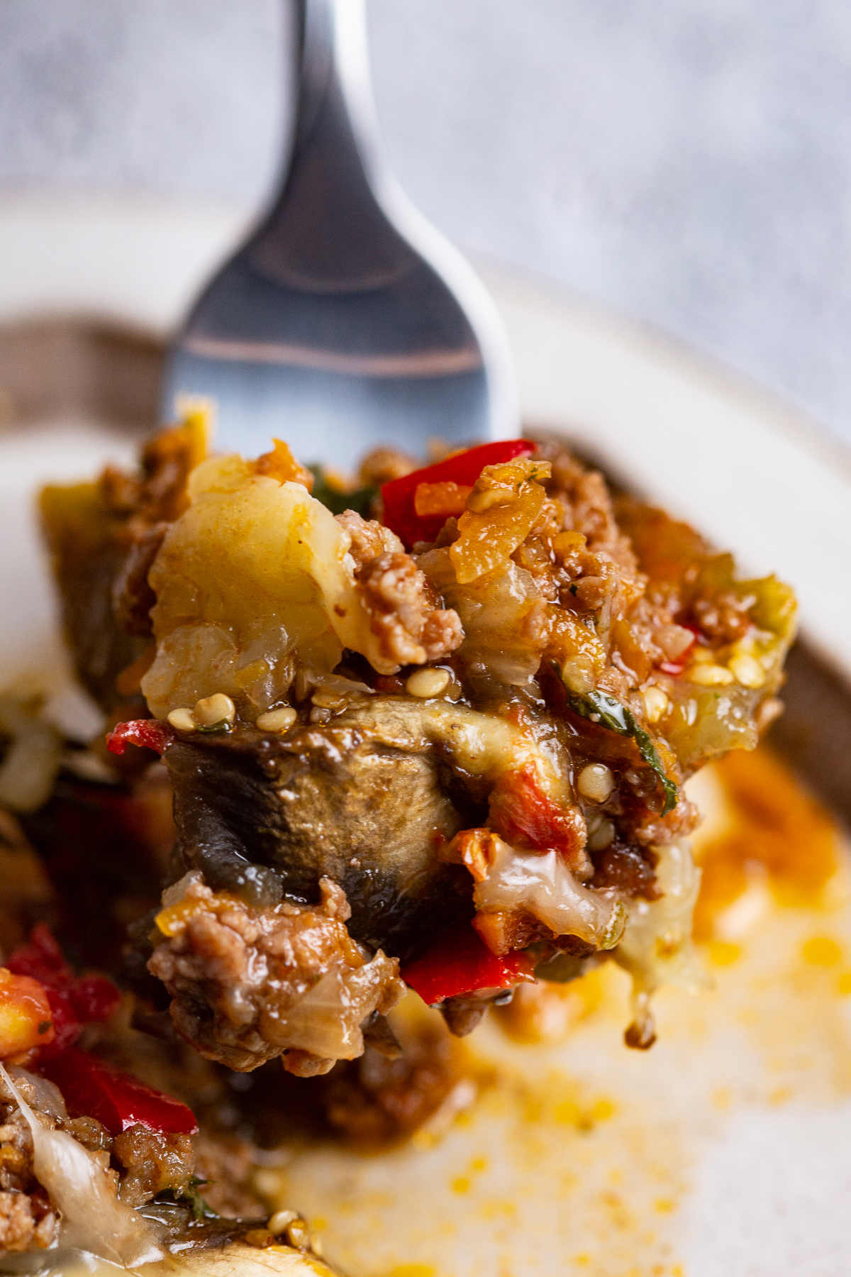 Closeup of eggplant stuffing on a fork.