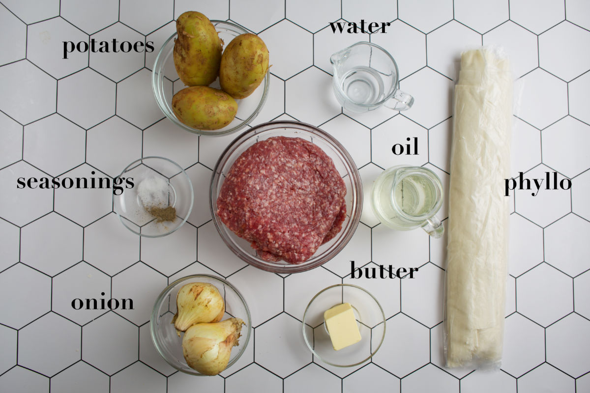 Eight pie elements on a coney comb white background.   Floor Pork and Potato Pie with Phyllo Rec ingredients