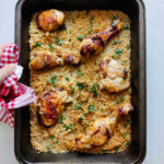 Rice and chicken in a sheet pan, overhead.