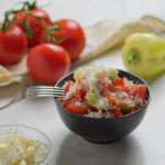 Salad and salad ingredients on a white background.