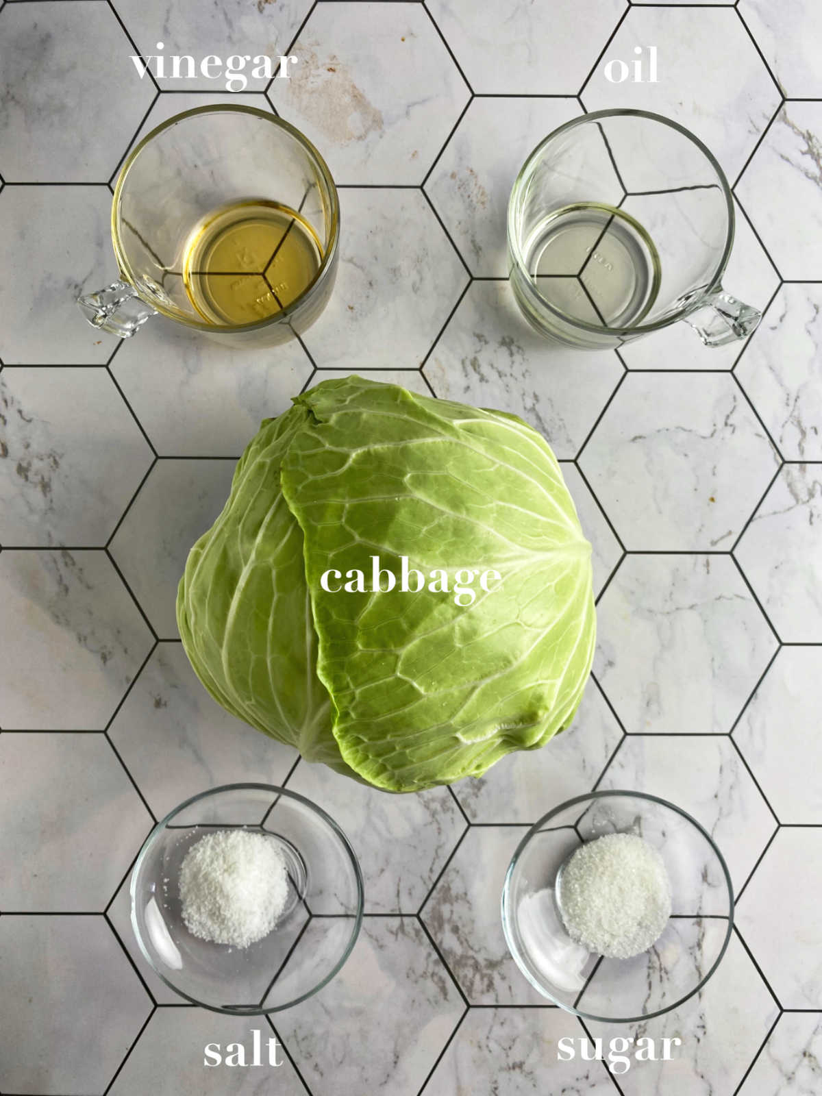 Ingredients for cabbage salad on a honeycomb background: cabbage, vinegar, oil, sugar and salt.