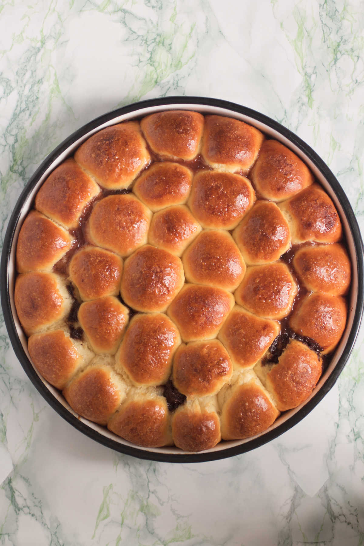 Overhead photograph of a pan filled with rolls.