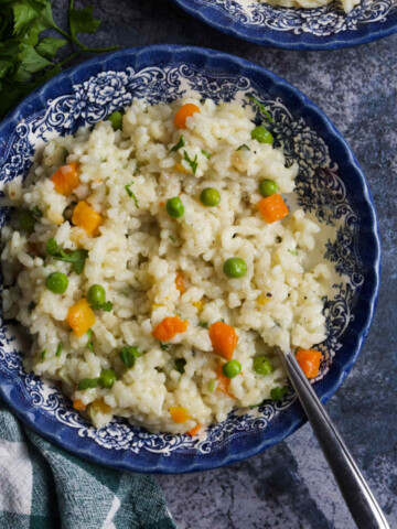 A bowl of rice overhead, with a spoon inside.