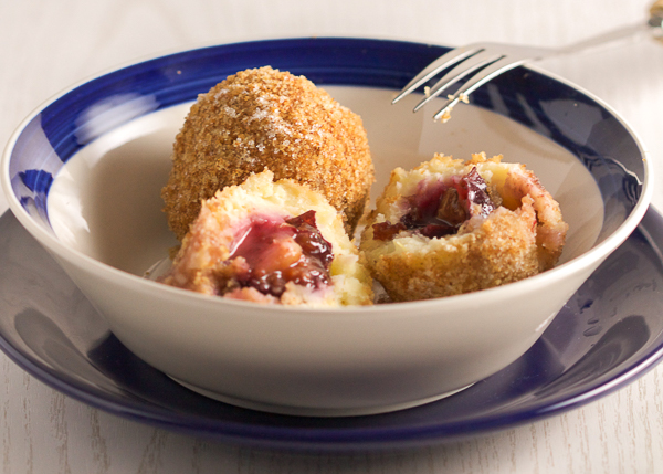 Plums encased in a potato based dumpling dough, boiled and breaded. An old Balkan delicacy. 