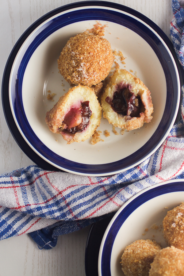 Plums encased in a potato based dumpling dough, boiled and breaded. An old Balkan delicacy. 