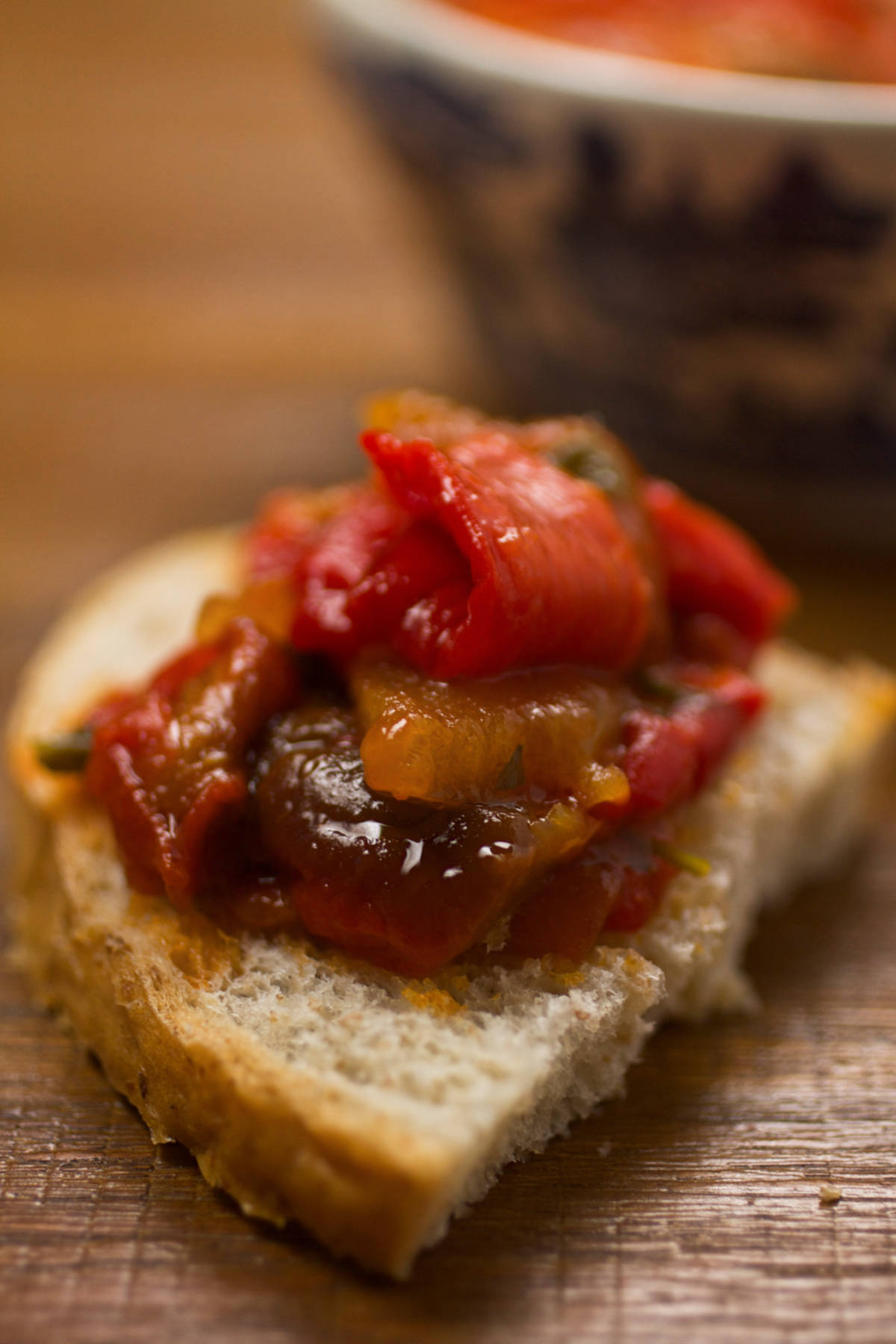 Sandwich wiwth pindjur salad on a table. 