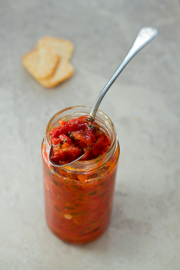 Pindjur is a luscious salsa like spread made by roasting tomatoes and peppers, and then simmering them over medium heat with herbs. 