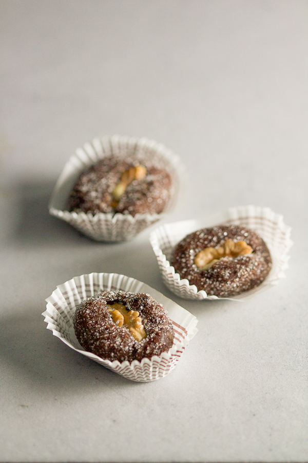 Apricot raisin walnut cookie boats: a simple cookie with a complicated name. Apricots and raisins ground in a meat grinder, combined with sugar and chocolate, then topped off with a walnut. 