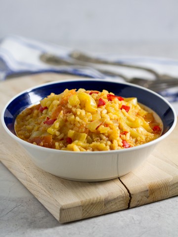 Satarash, or Risotto stir fry: a contemporary take on a classic. Round grain rice simmered in a sauce of bell peppers, yellow onions and tomatoes for a light and filling vegetarian favorite.