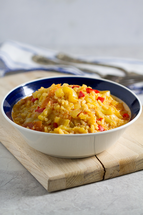 Satarash, or Risotto stir fry: a contemporary take on a classic. Round grain rice simmered in a sauce of bell peppers, yellow onions and tomatoes for a light and filling vegetarian favorite. 