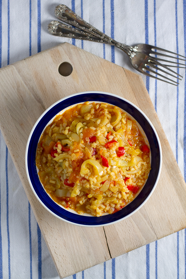 Satarash, or Risotto stir fry: a contemporary take on a classic. Round grain rice simmered in a sauce of bell peppers, yellow onions and tomatoes for a light and filling vegetarian favorite. 