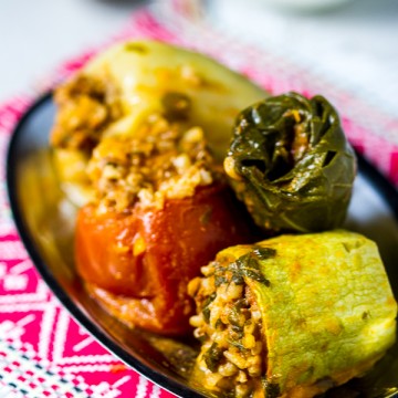 Dolmas, or stuffed vegetables, is maybe the most recognizable dish from the Balkans. Ground beef is mixed with onions, garlic plus spices, and used as a filling for several veggies (zucchini, onions, tomatoes, peppers and Swiss chard), until it's all finally baked it in a tomato sauce based sauce.