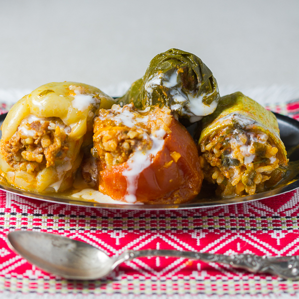 Dolmas, or stuffed vegetables, is maybe the most recognizable dish from the Balkans. Ground beef is mixed with onions, garlic plus spices, and used as a filling for several veggies (zucchini, onions, tomatoes, peppers and Swiss chard), until it's all finally baked it in a tomato sauce based sauce. 