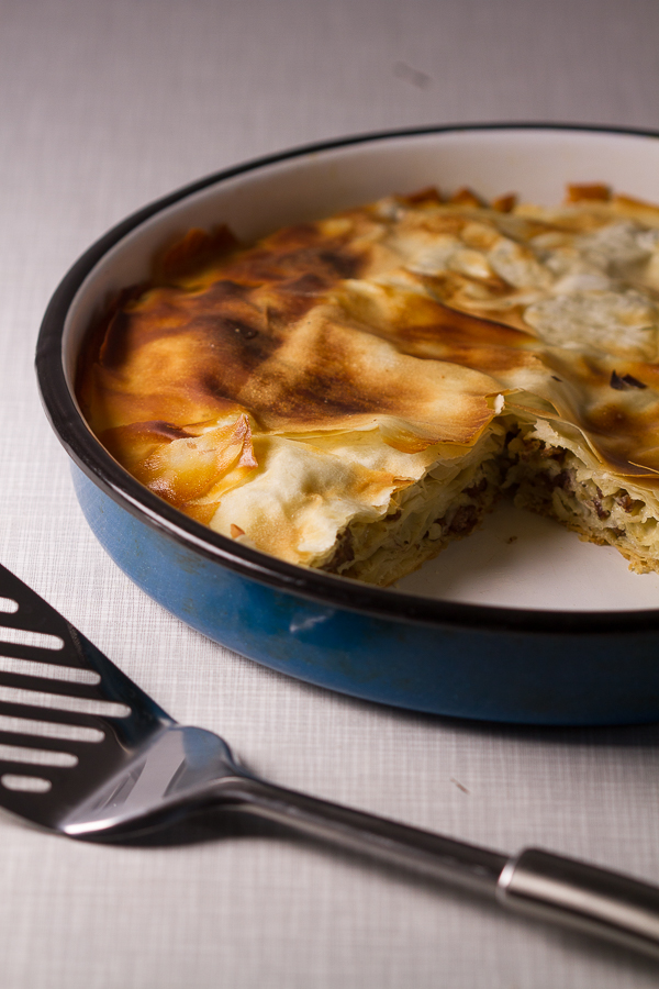 Ground beef phyllo pie. Ground beef (or veal) layered in phyllo sheets softened with butter, then baked until golden. Much pie. Not much fuss. 