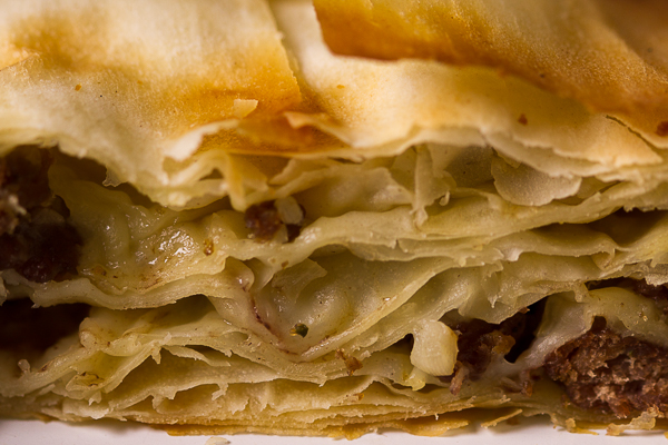 Ground beef phyllo pie. Ground beef (or veal) layered in phyllo sheets softened with butter, then baked until golden. Much pie. Not much fuss. 