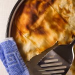 Ground beef phyllo pie. Ground beef (or veal) layered in phyllo sheets softened with butter, then baked until golden. Much pie. Not much fuss.