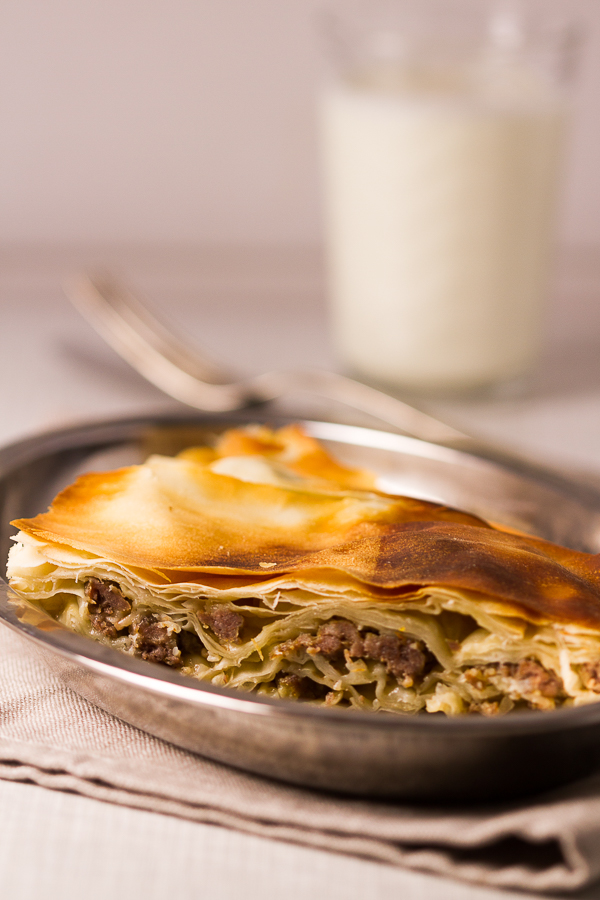 Ground beef phyllo pie. Ground beef (or veal) layered in phyllo sheets softened with butter, then baked until golden. Much pie. Not much fuss. 