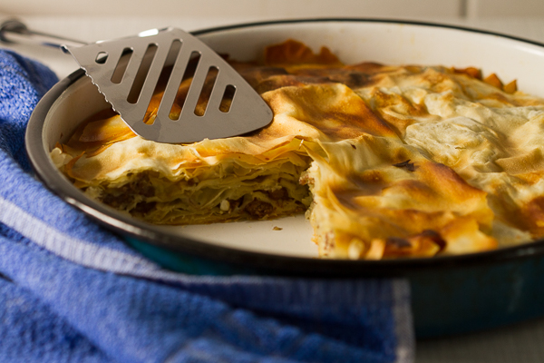 Ground beef phyllo pie. Ground beef (or veal) layered in phyllo sheets softened with butter, then baked until golden. Much pie. Not much fuss. 