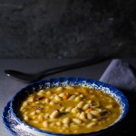Dry beans soaked, added to simmered vegetables and meat, cooked over low fire, then thickened with a paprika based roux. The result is a delicious thick soup (stew) overflowing with meaty, hearty beans processed to perfection.