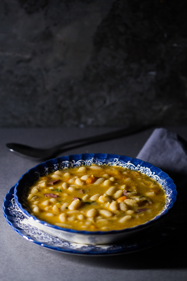 Dry beans soaked, added to simmered vegetables and meat, cooked over low fire, then thickened with a paprika based roux. The result is a delicious thick soup (stew) overflowing with meaty, hearty beans processed to perfection.