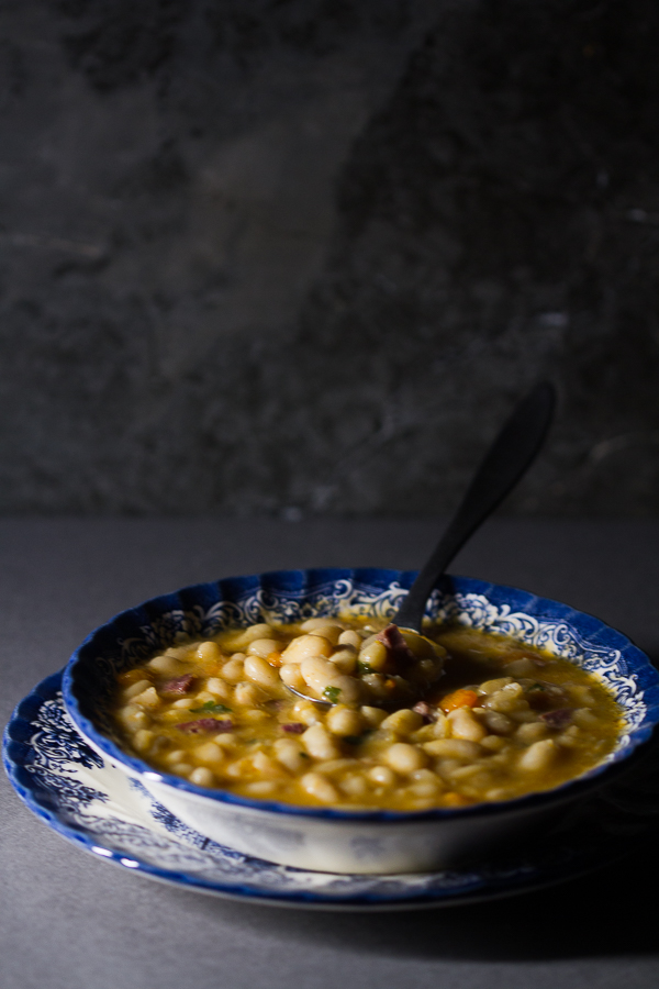 Dry beans soaked, added to simmered vegetables and meat, cooked over low fire, then thickened with a paprika based roux. The result is a delicious thick soup (stew) overflowing with meaty, hearty beans processed to perfection. 