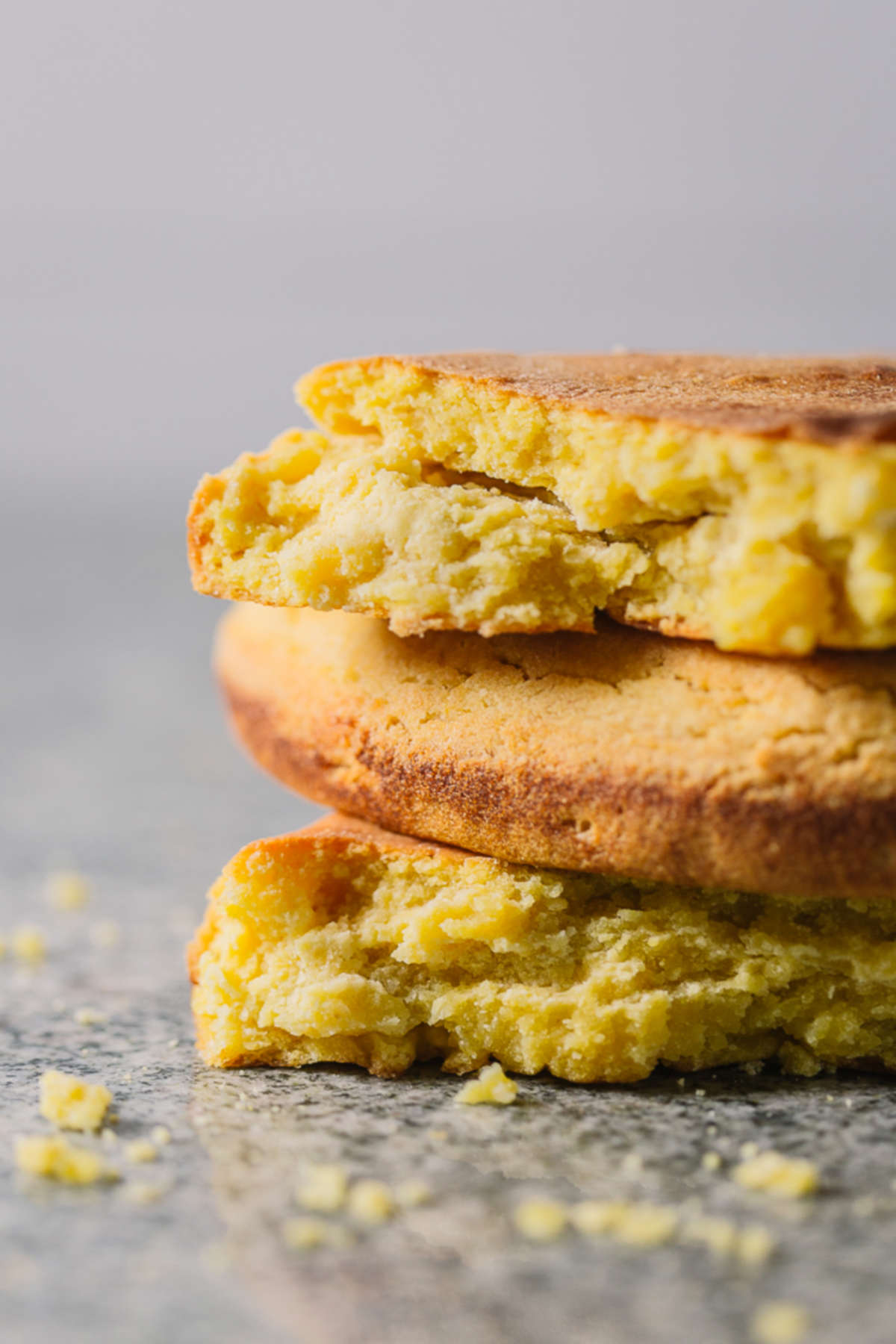 Three pieces of cornbread on top of each other.