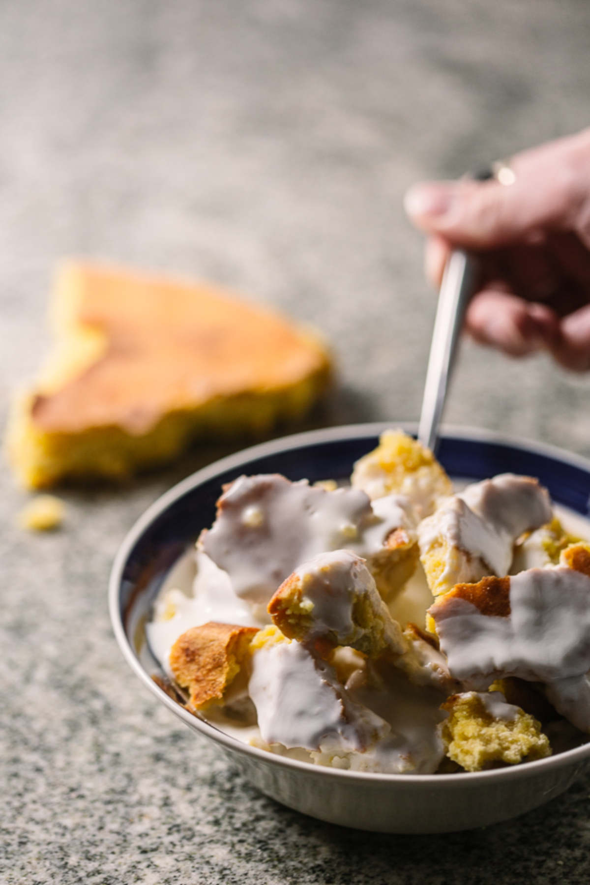 Spoonful of cornbread in milk.