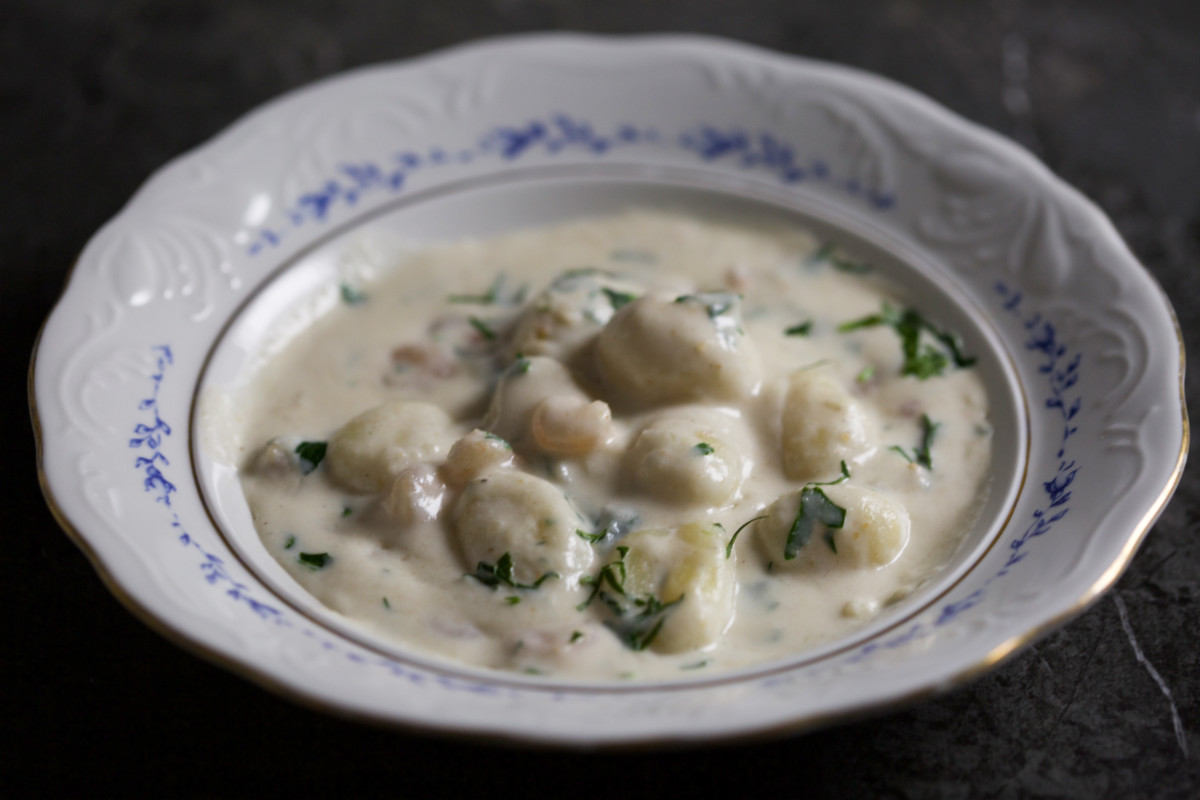 Bowl of gnocchi with shrimp. 