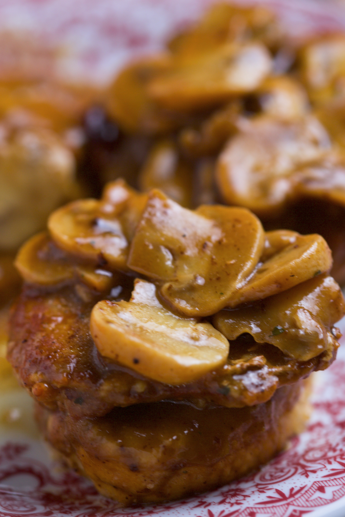 Close up of mushrooms on top of meat