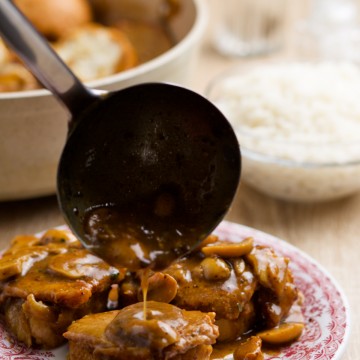 Sauce being poured over medallions