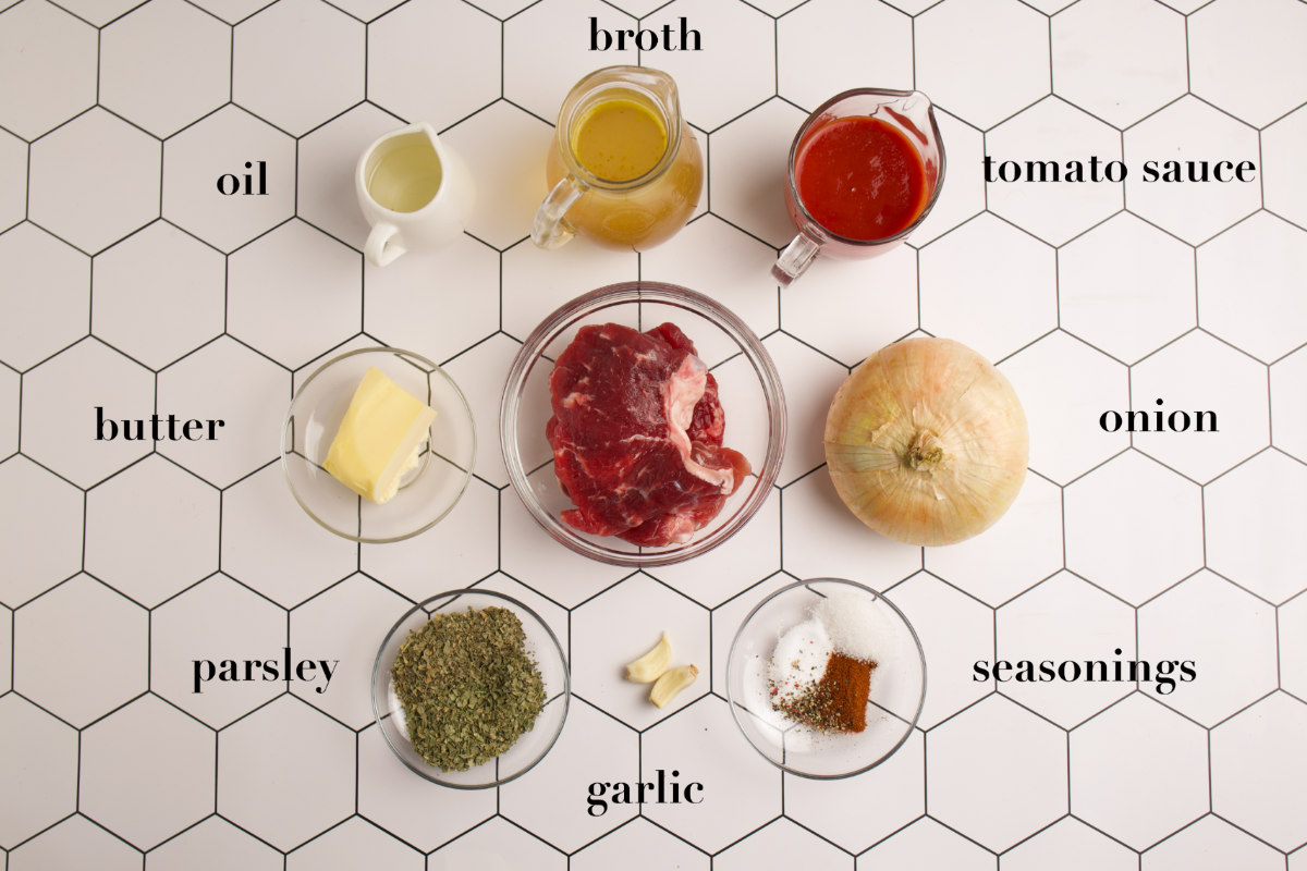 Nine ingredients placed on a table. 