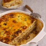 Moussaka layers in a pan.