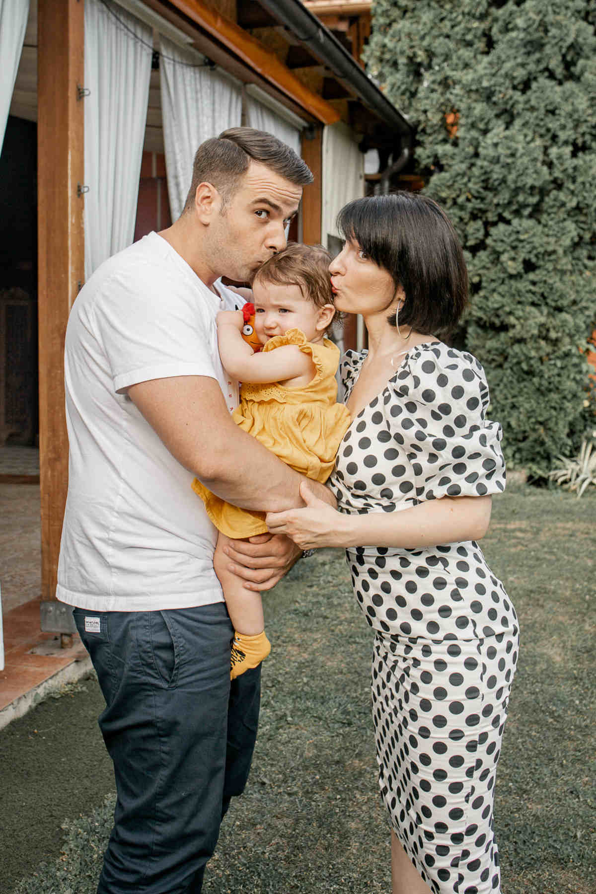 Two adults and a child between them. 