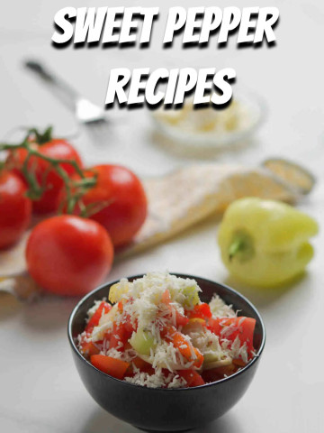 Bowl with salad, tomatoes, cheese and green pepper on gray background.
